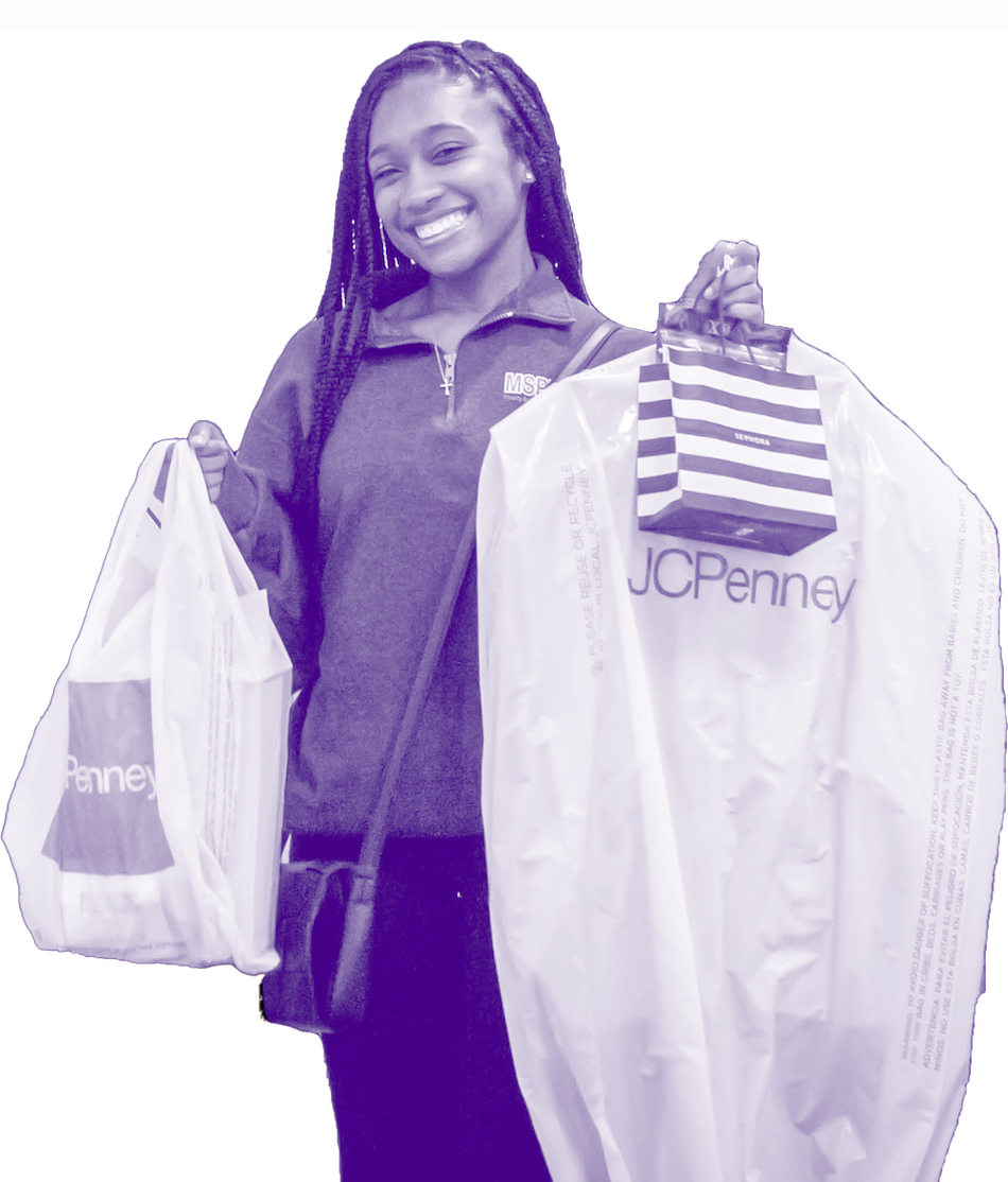 student holding garment bags at JCPenney Suit Up event