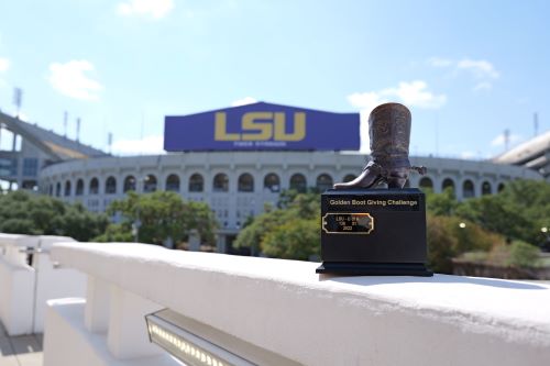 golden boot trophy in front of tiger stadium 