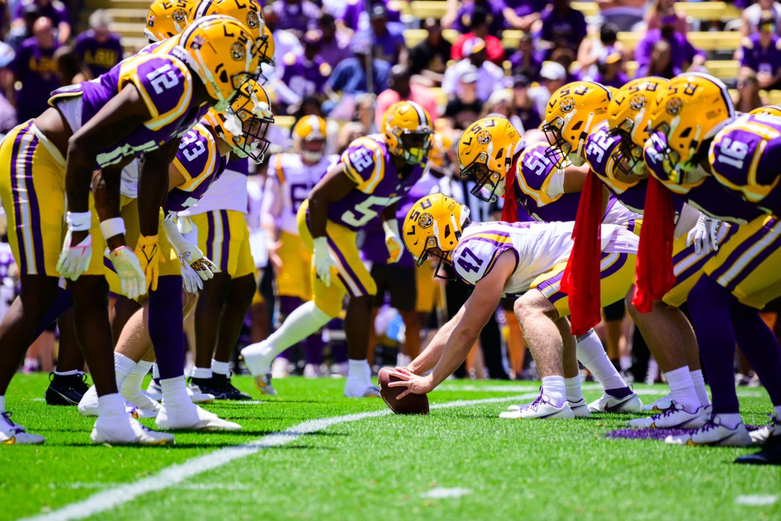 Jake Davis preparing to snap the football during game action in Tiger Stadium