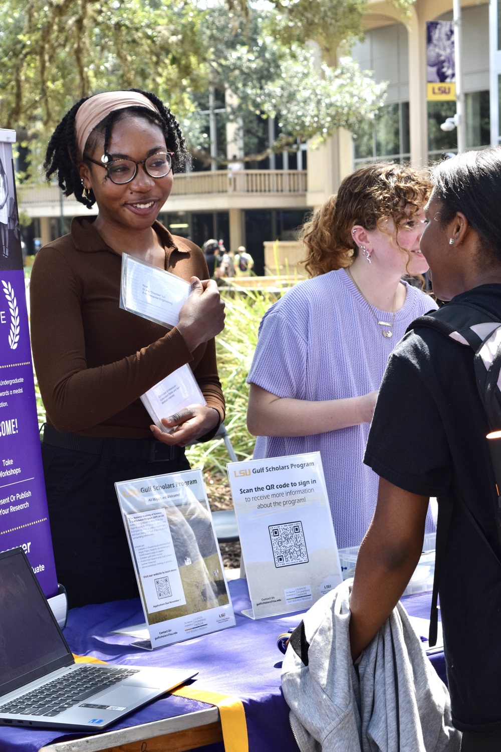 Student sharing information at a campus event