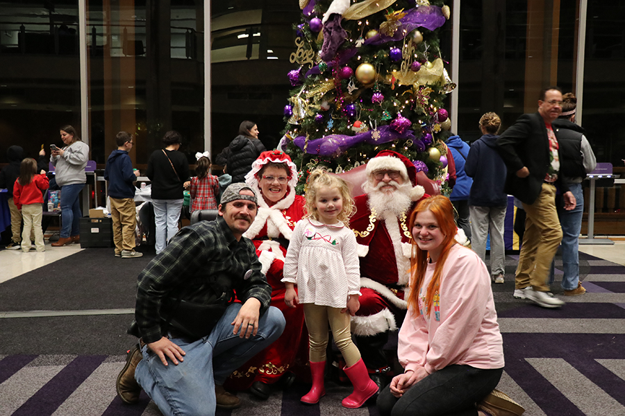 family with Santa and Mrs. Claus